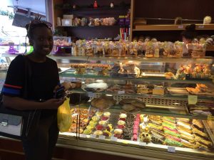 African-Australian student at a patisserie in Noumea.