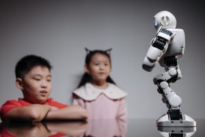 Boy and girl with white humanoid robot
