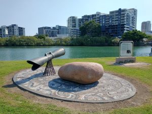 The Mabo Sculpture located on the Pioneers Walk in Townsville, showing Ross Creek in the background.