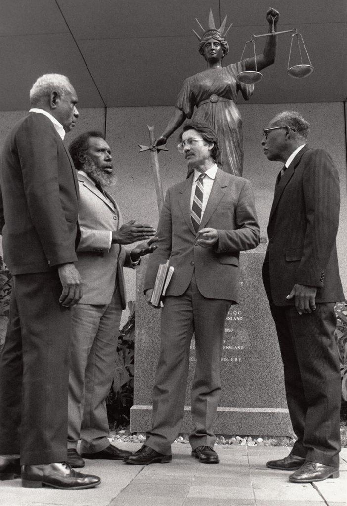 Koiki Mabo and the continuing plaintiffs, Reverend David Passi and James Rice, with lawyer Bryan Keon-Cohen outside court in 1989