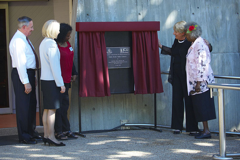 Honoured guests unveil the plaque to officially name the Townsville Library, Eddie Koiki Mabo Library.