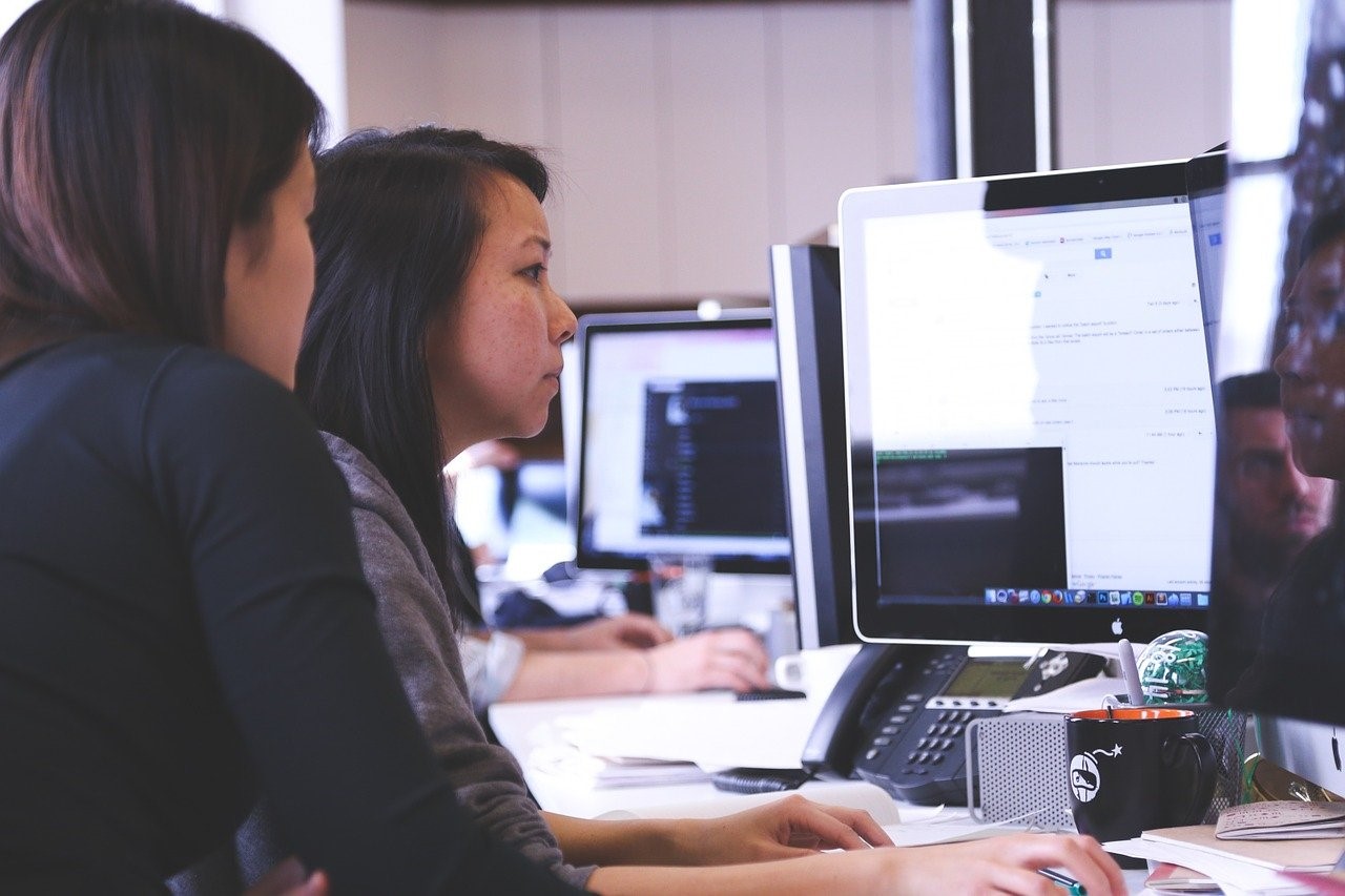 Two woman looking at computer